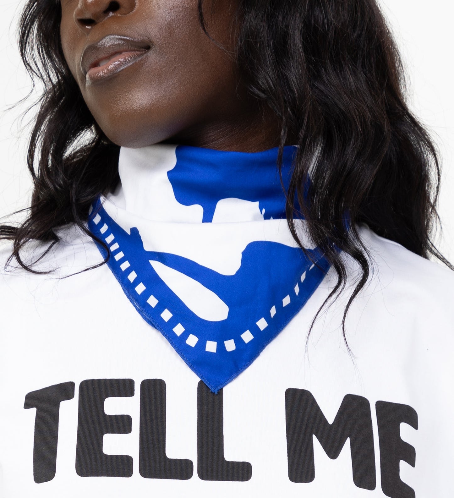 model wearing blue blem bandana around neck