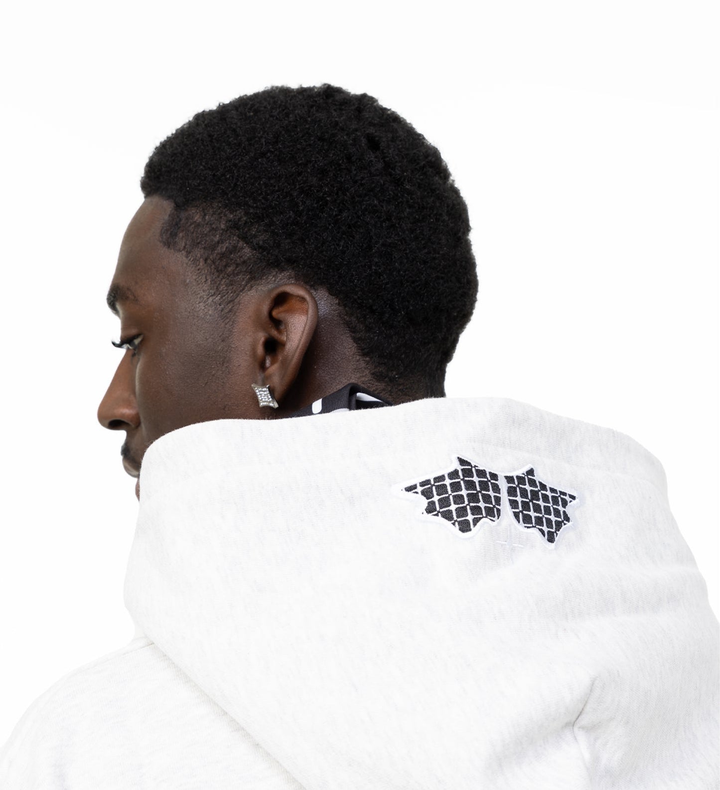 Model hood view of grey blem hoodie