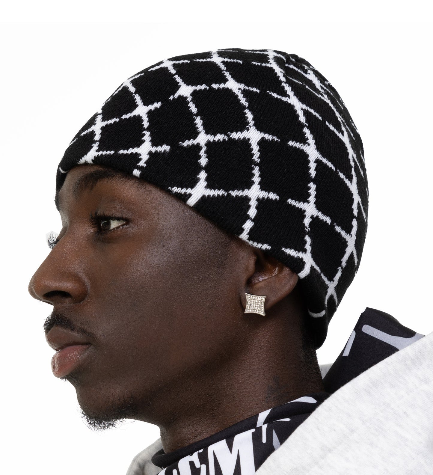 man wearing a black and white beanie 